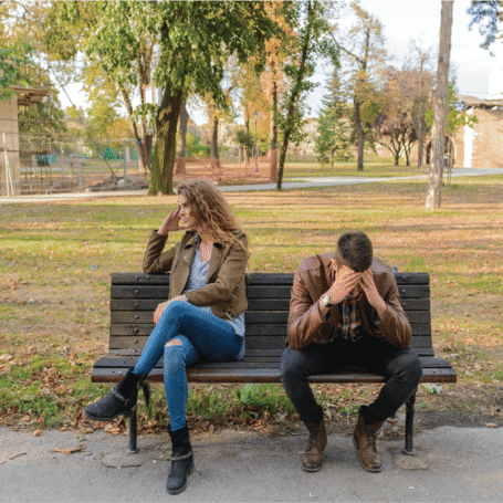 Frustrated couple on a bench