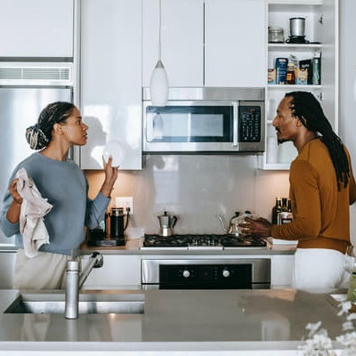 Couple arguing in a kitchen