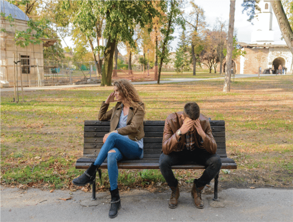 Frustrated couple on a bench